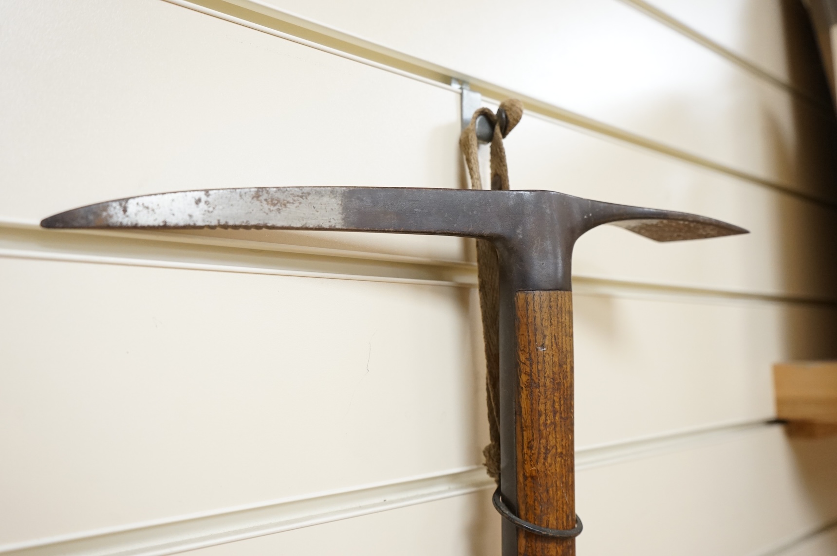 An early 20th century German mountaineer’s ice pick with oak shaft, the head stamped ‘Prima=Garantie Fulpmes’.